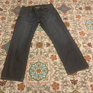 Levis 38x32. Bottom back beltloop detached